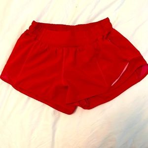 Bright red lululemon 2.5 in hotty hot shorts